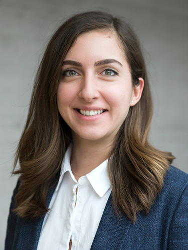 A portrait of a young woman with shoulder-length brown hair. A portrait of a young woman with shoulder-length brown hair.