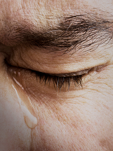 Close-up of a crying person Close-up of a crying person