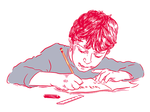 Boy takes notes in school Boy takes notes in school