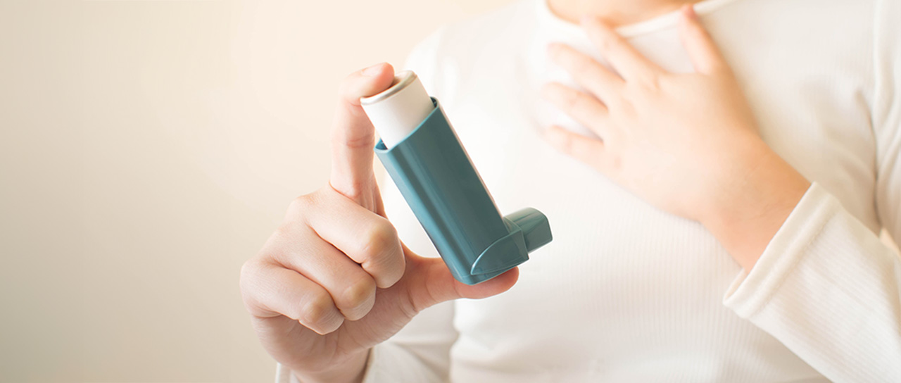 Child with asthma inhaler